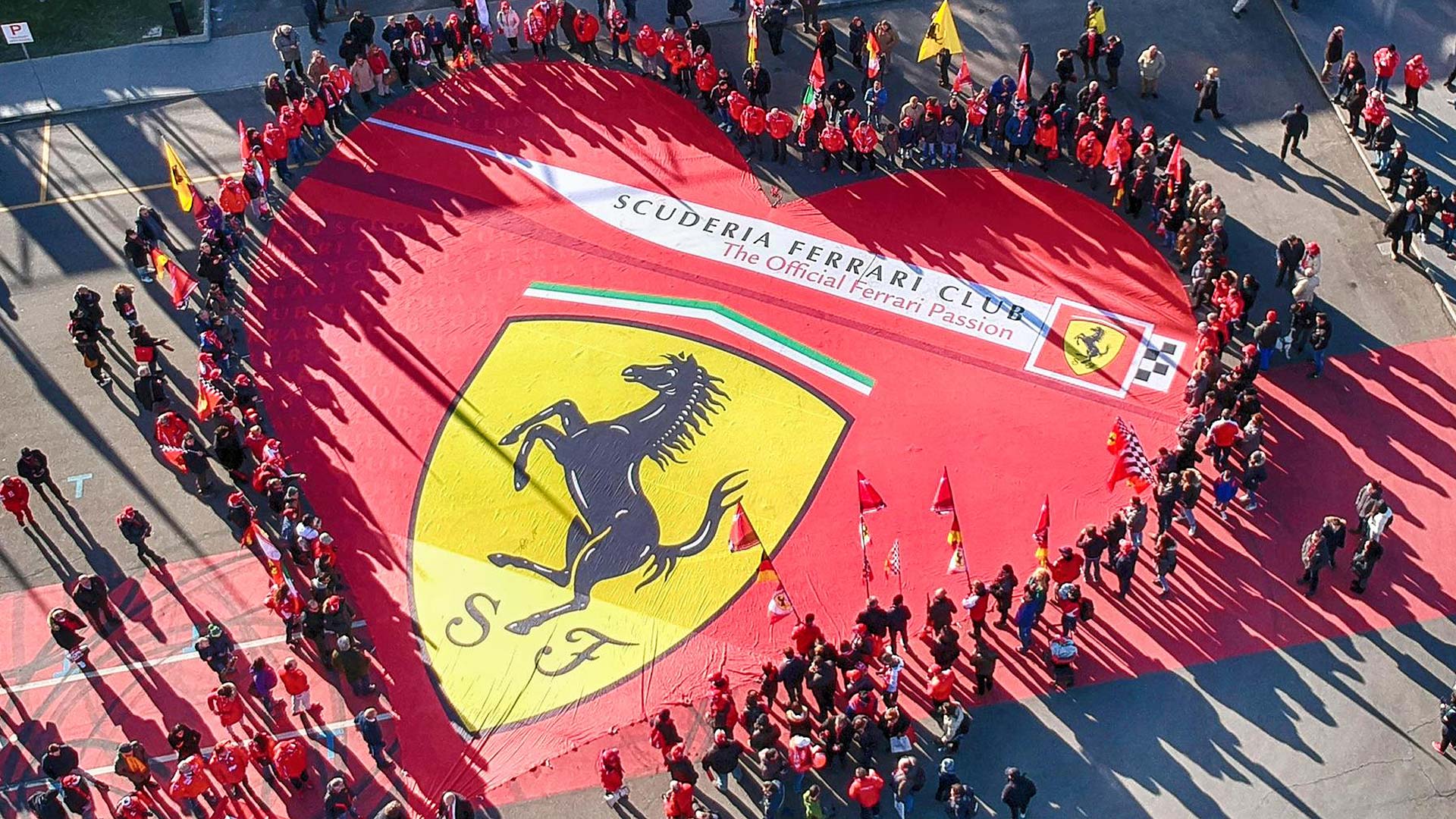 Ferrari fans with the Scuderia logo