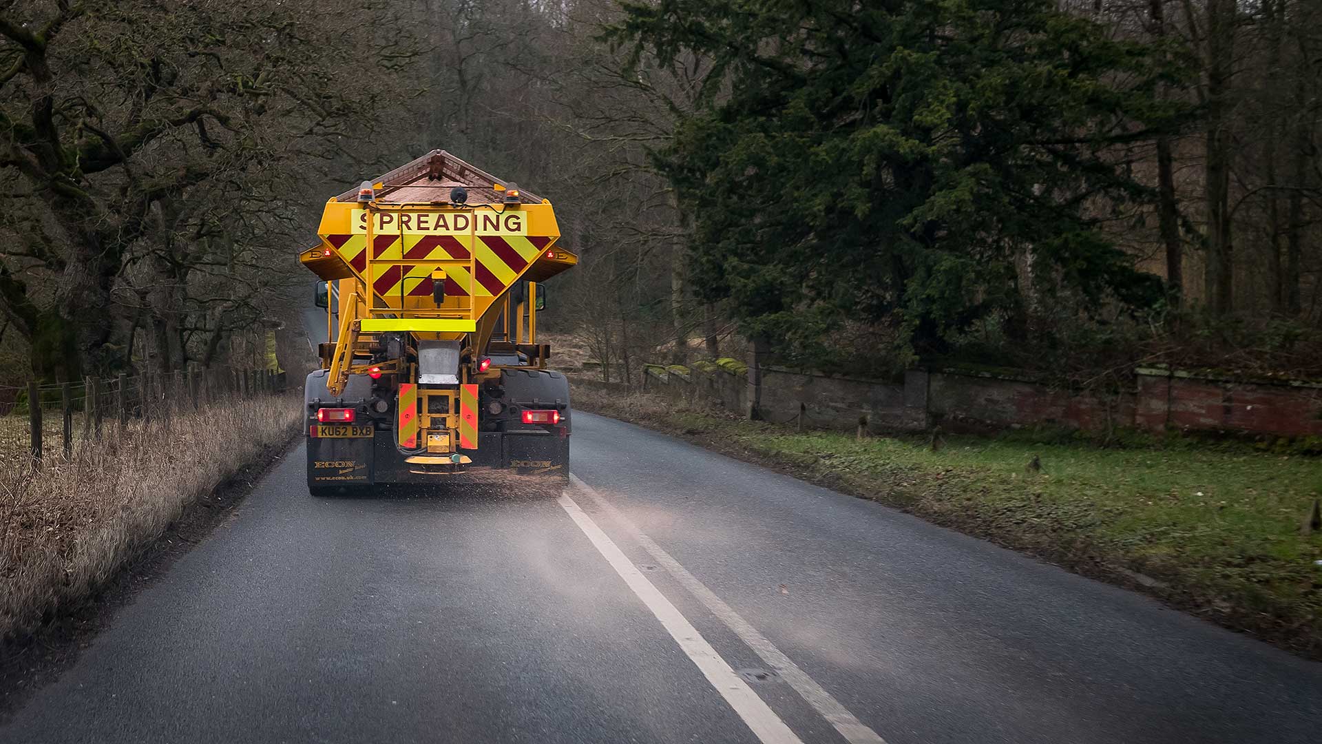 Road gritter spreading salt on a British road