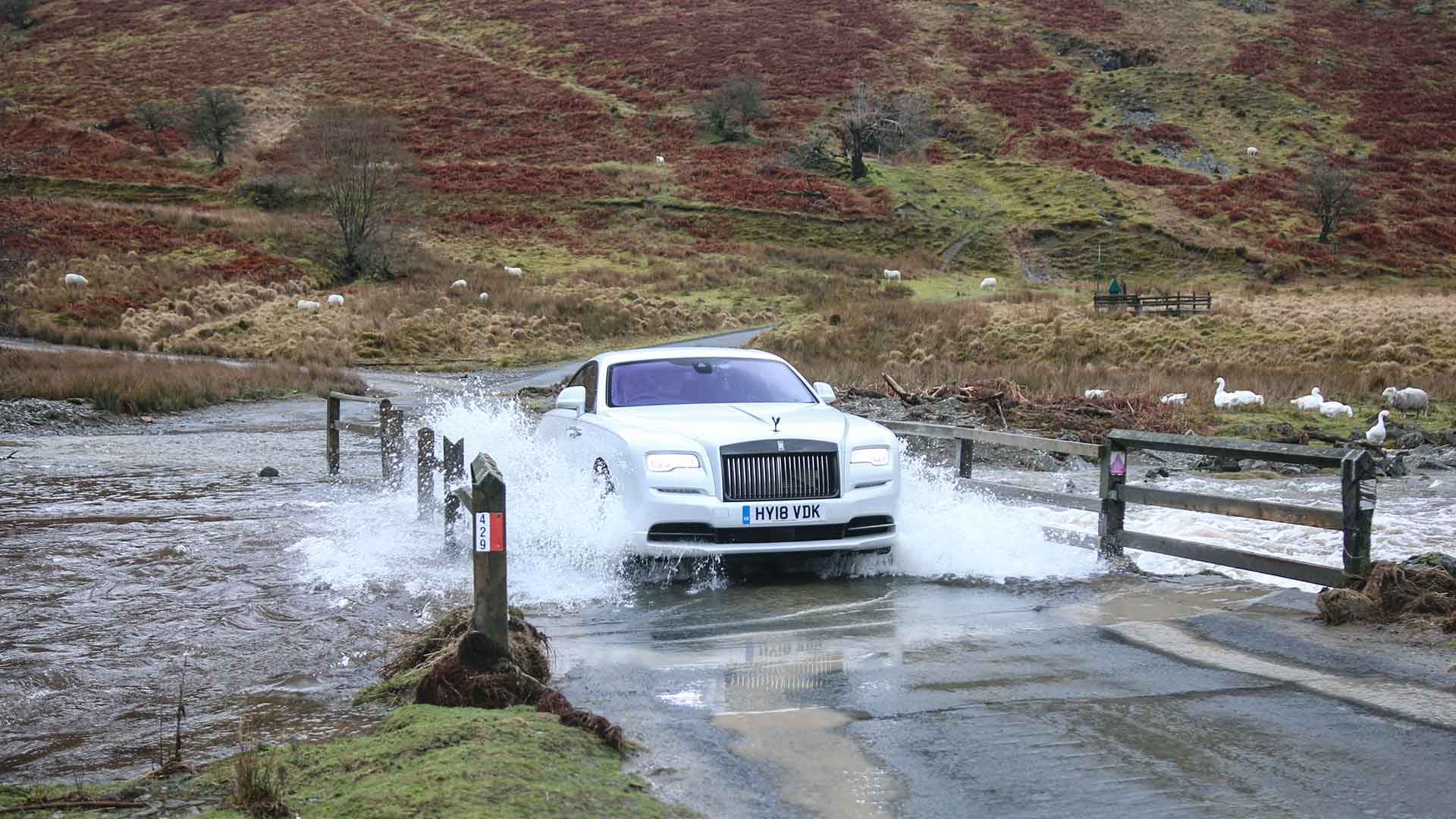 Rolls-Royce Wraith Black Badge driving through ford