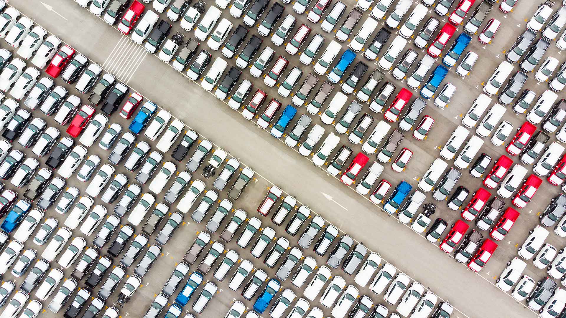 Rows of used cars in a parking lot
