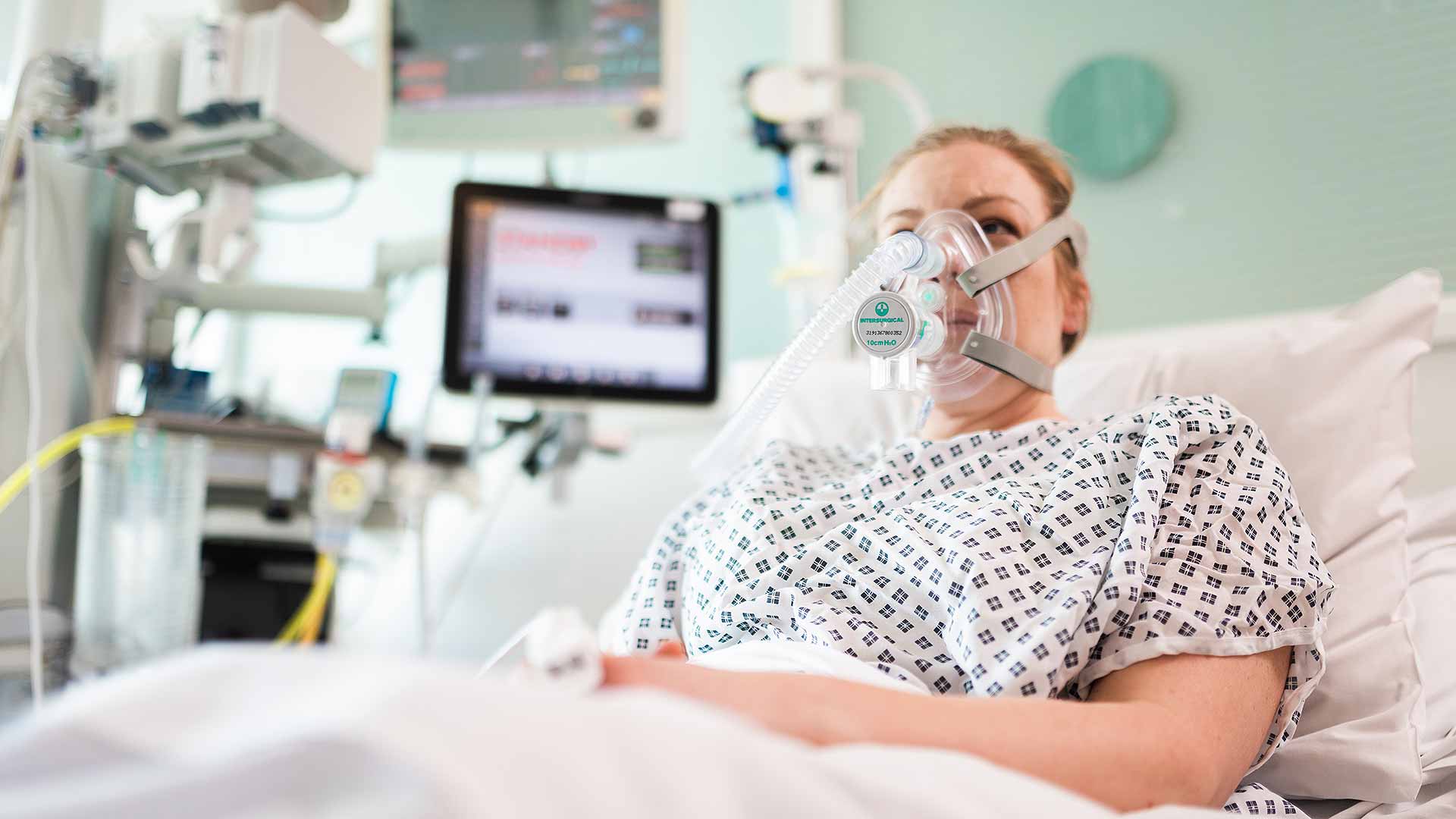 Patient demonstrating CPAP device