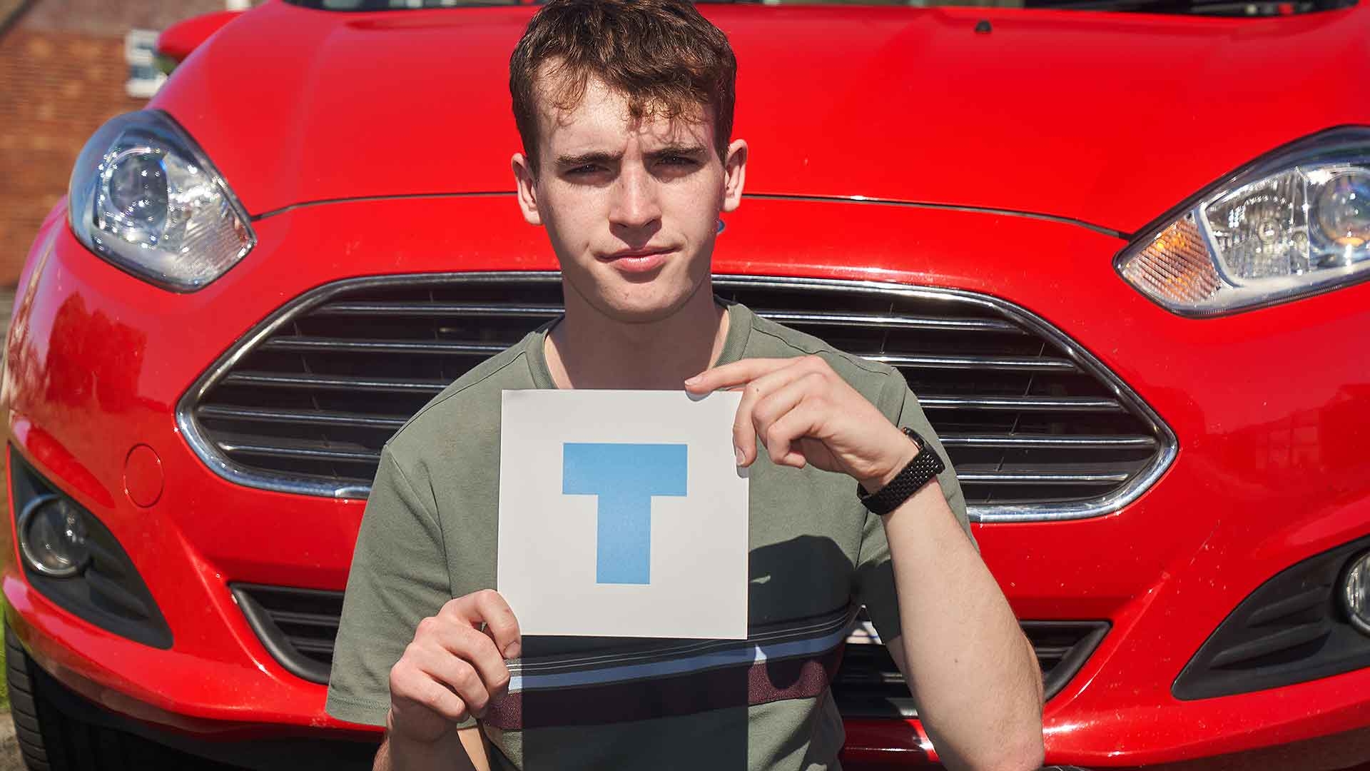 Young driver with a T-plate