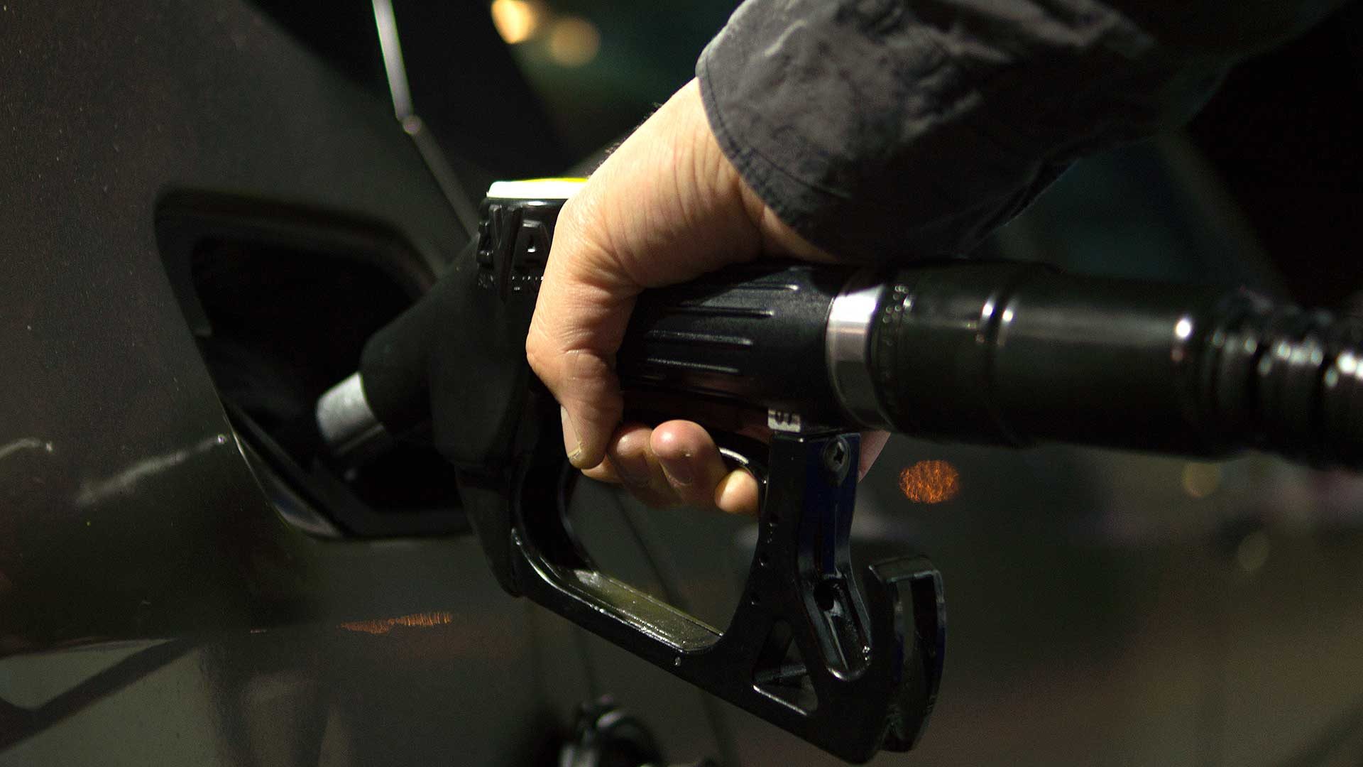 Filling a car with fuel at a petrol station