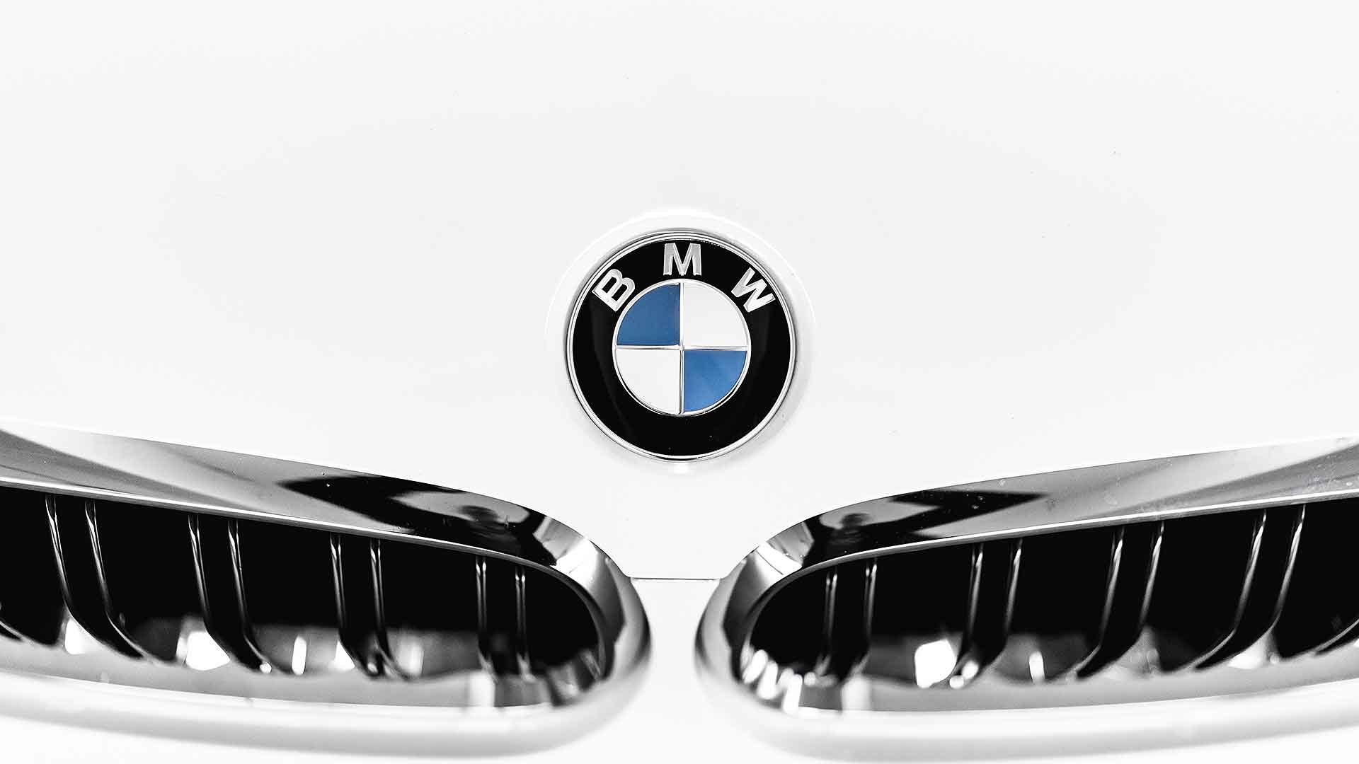 BMW badge on a white car
