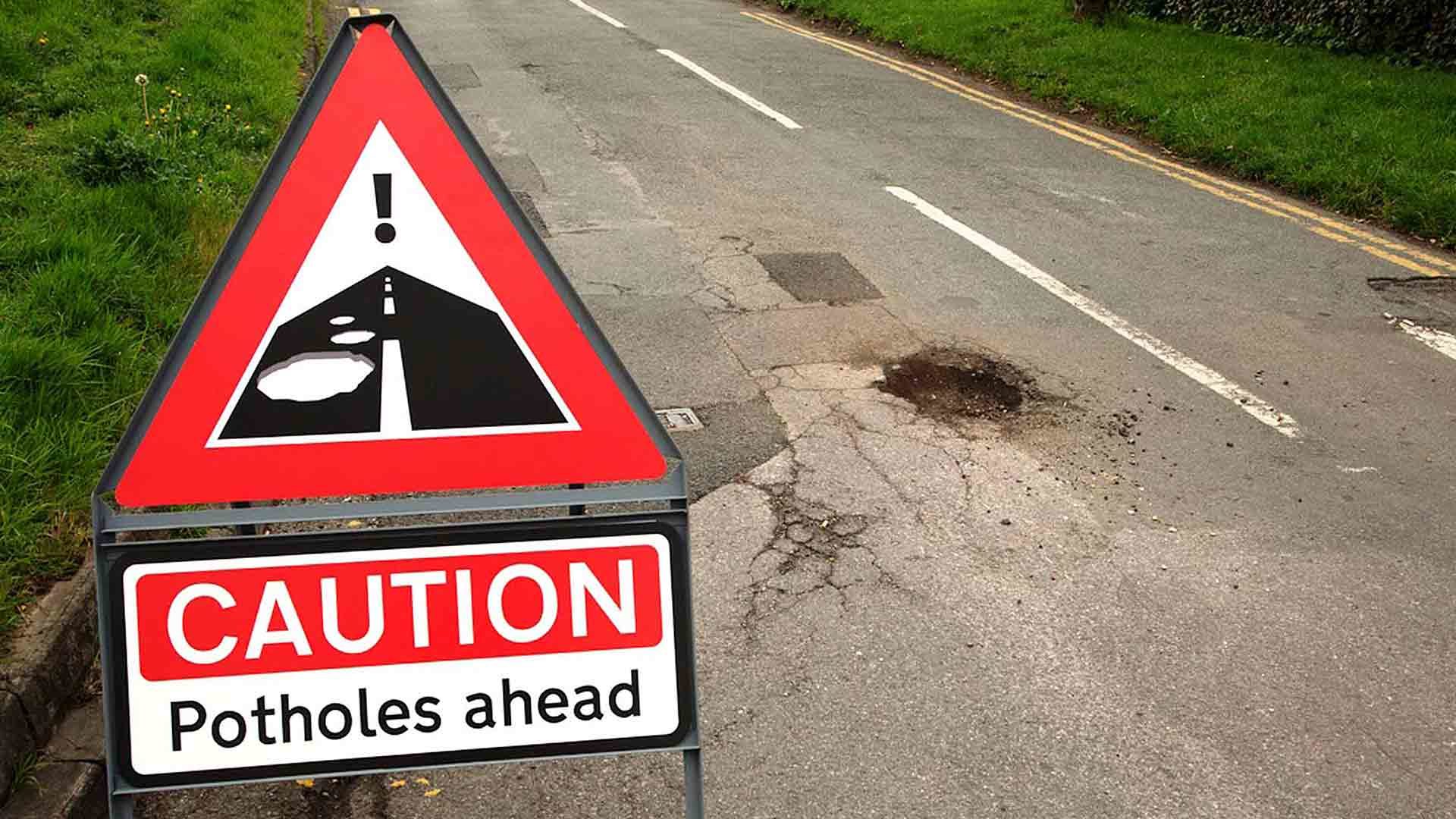 Potholes warning sign