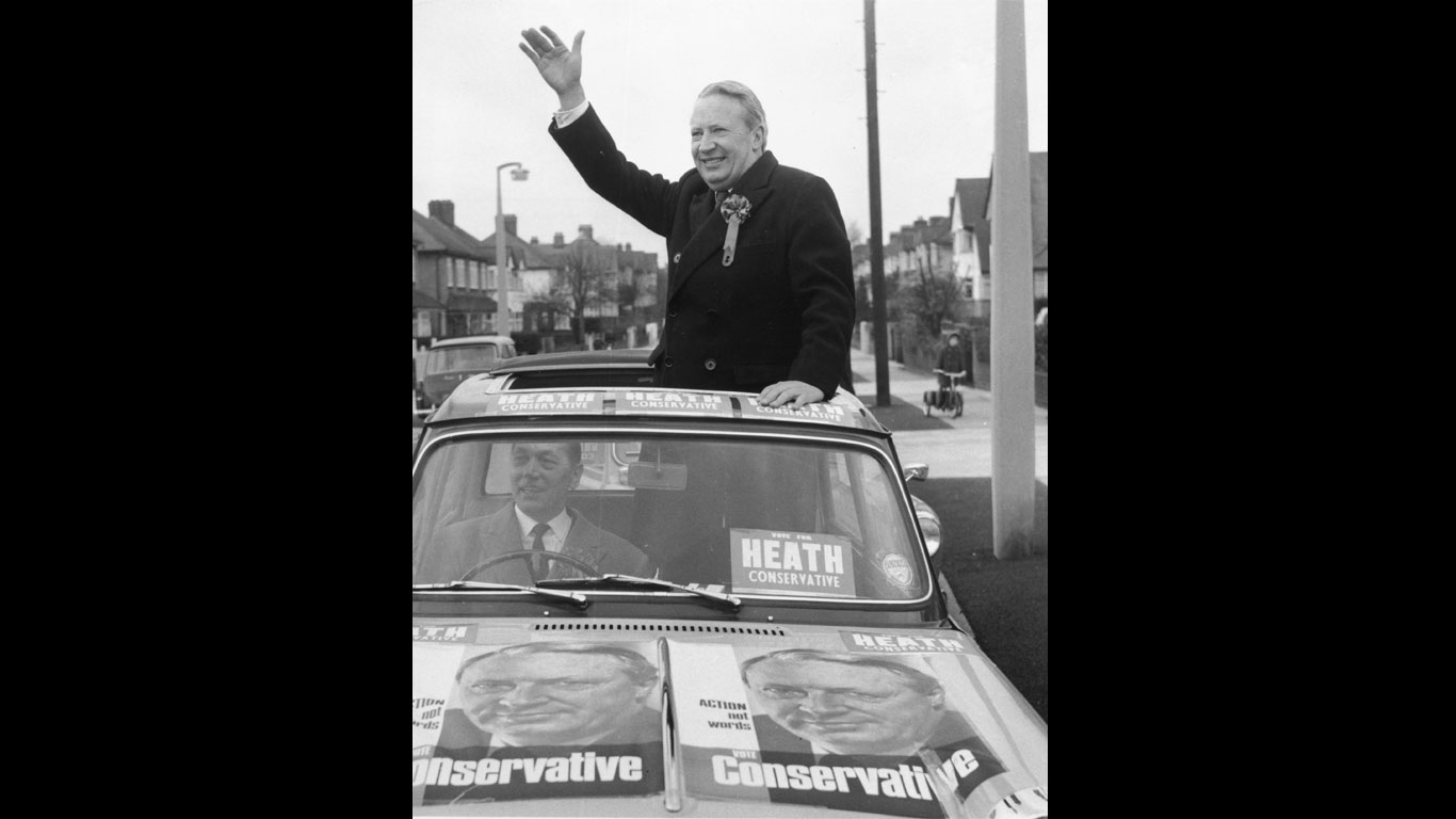 Sir Edward Heath in a Triumph Herald