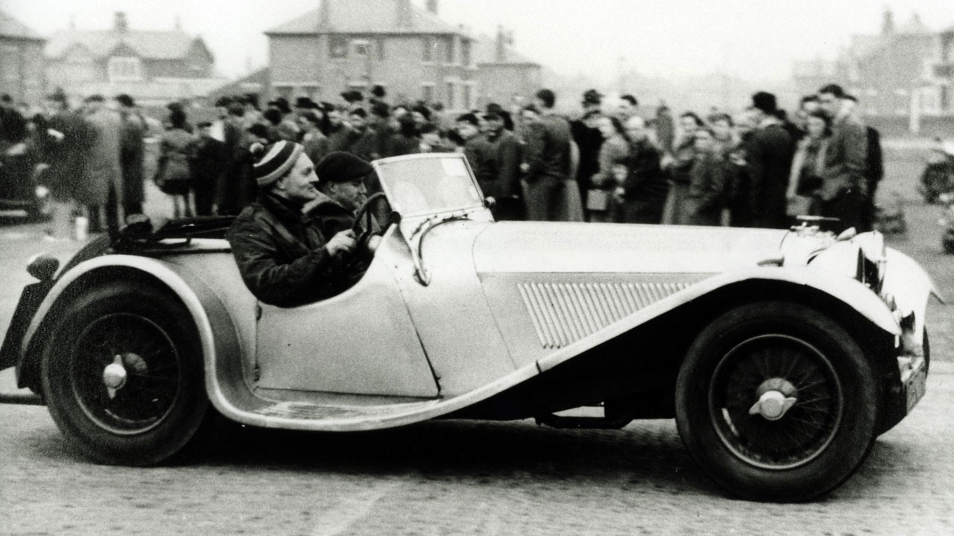 Alan Clark in a Jaguar SS100