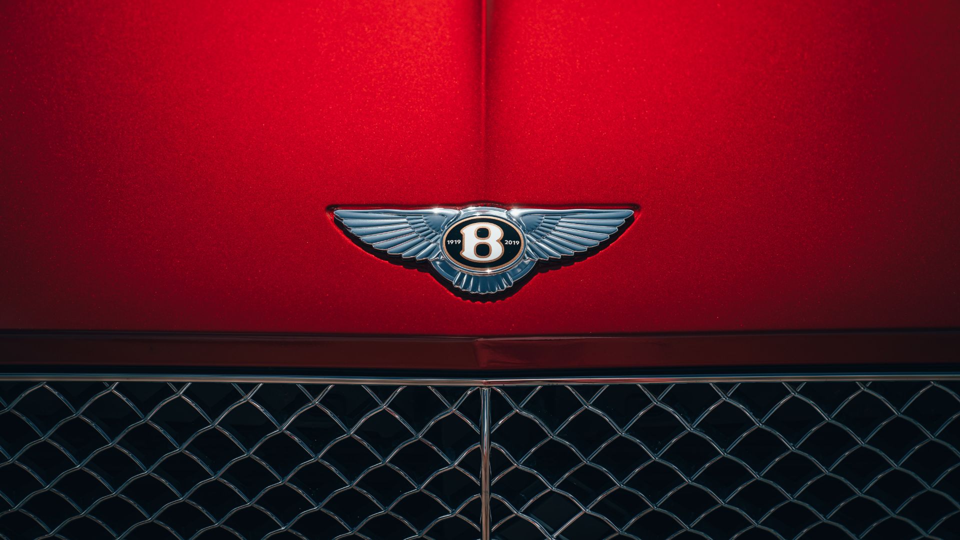 The Bentley emblem is asymmetrical